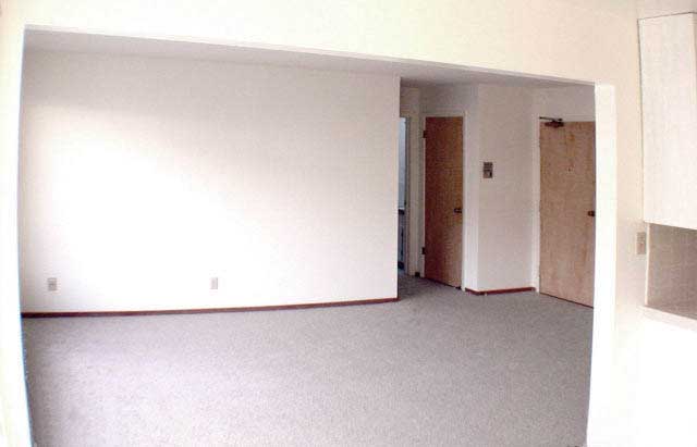 Image of living room, hall closet & front door