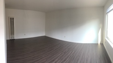 Living room with dining area at right rear