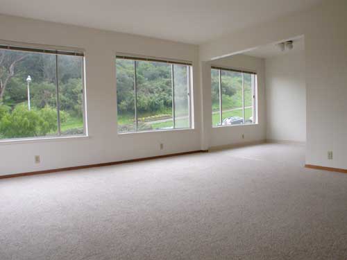 Living room and dining room with park views